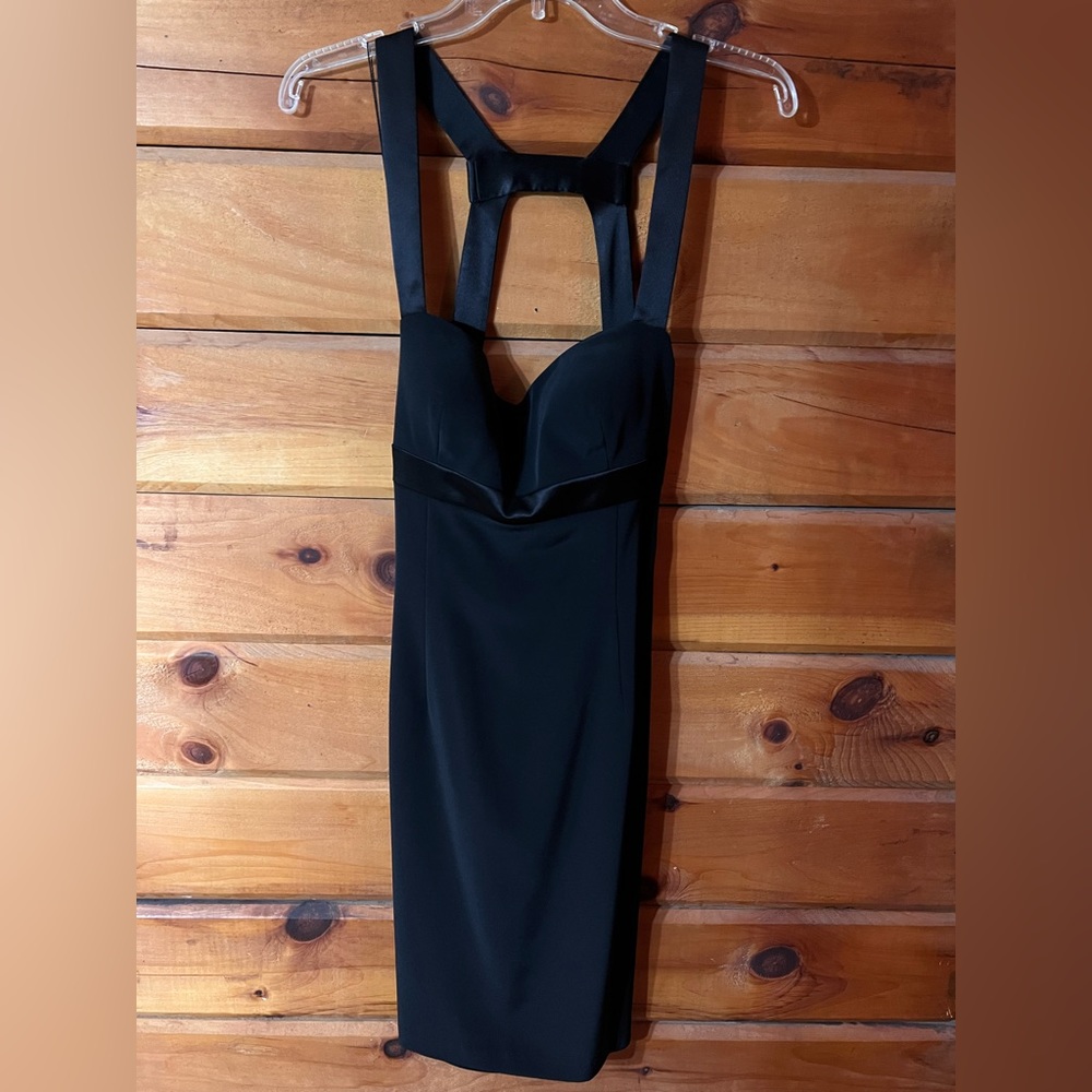 Black dress. Size eight. Never worn. Low back